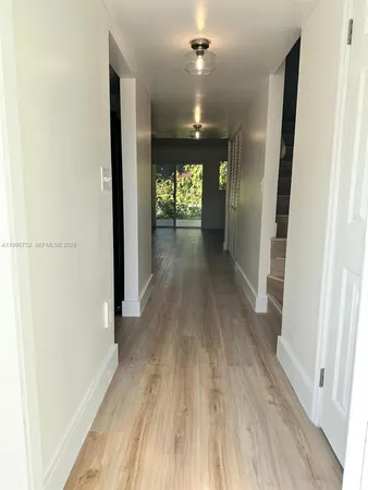 a view of gallery with wooden floor