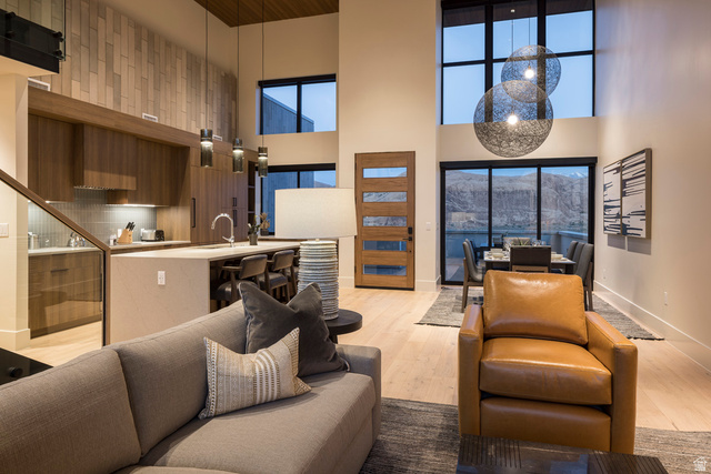 213 Lionsback Loop, Unit 38 Moab, UT 84532 - Photo 3 of 26 Open-concept living area featuring high ceilings and wood-finish flooring
