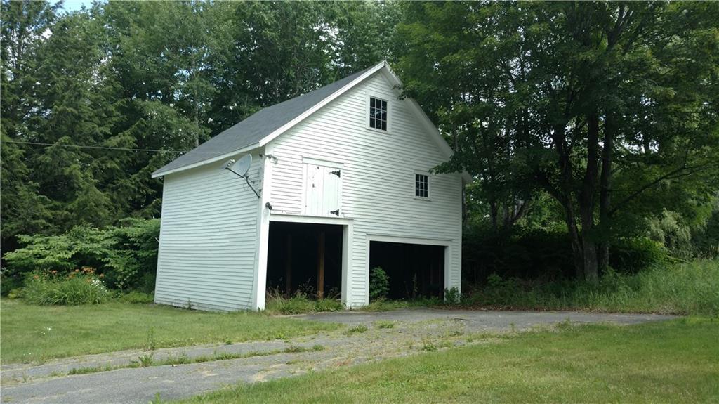 154 Knowlton Corner Road Farmington, ME 04938 - Photo 33 of 34 Garage with ample storage overhead.