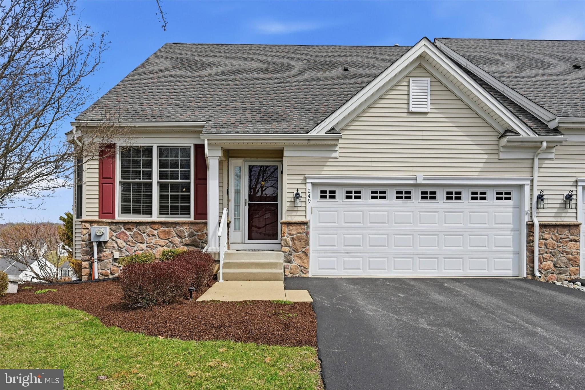 a front view of a house with a garage