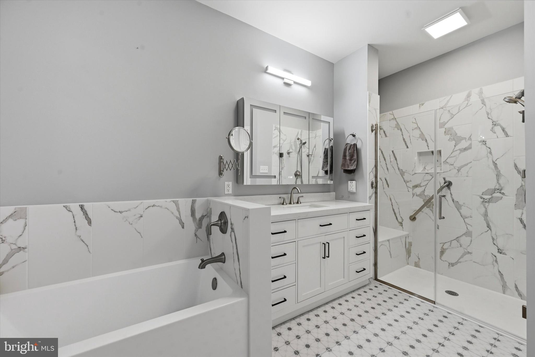 249 Stoyer Road Coatesville, PA 19320 - Photo 16 of 25 a bathroom with a bathtub sink vanity granite and a shower