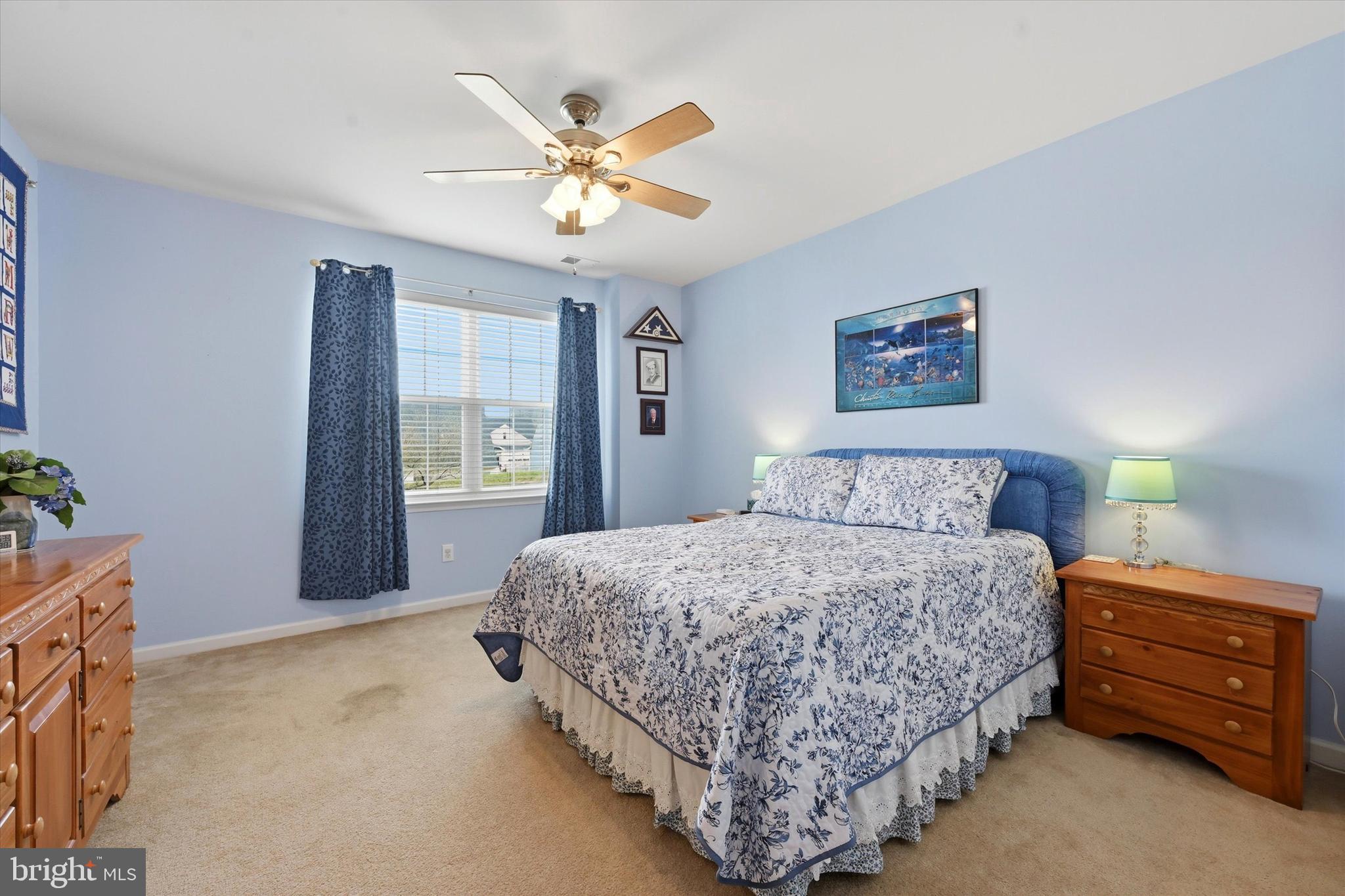 249 Stoyer Road Coatesville, PA 19320 - Photo 17 of 25 a bedroom with a bed and a chandelier
