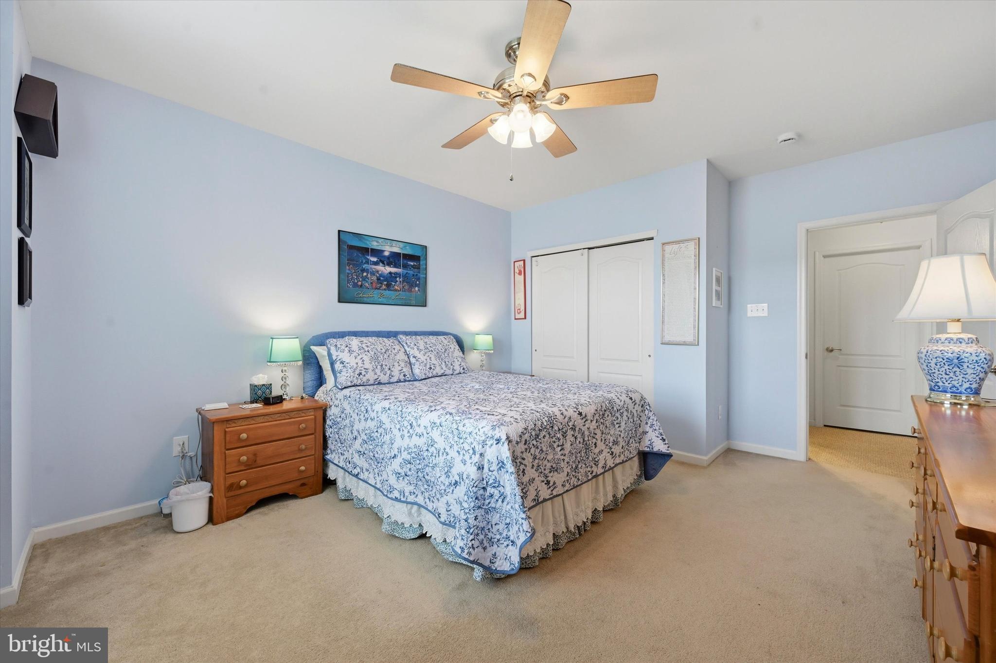 249 Stoyer Road Coatesville, PA 19320 - Photo 18 of 25 a spacious bedroom with a bed and a chandelier