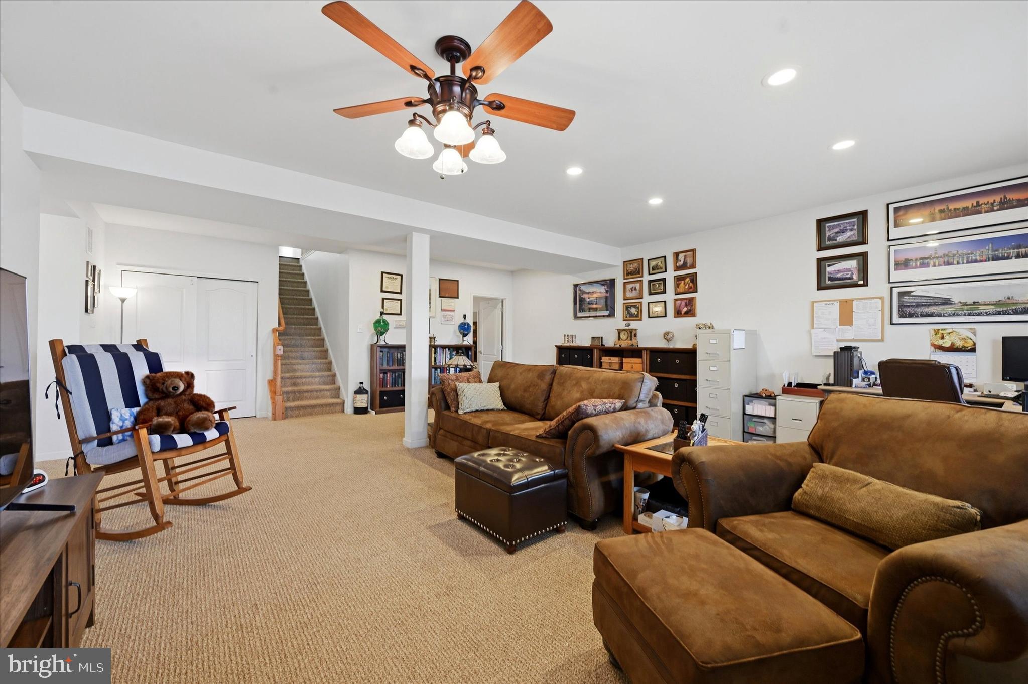 249 Stoyer Road Coatesville, PA 19320 - Photo 22 of 25 a living room with furniture a ceiling fan and a window