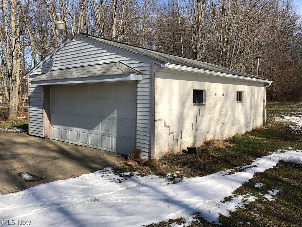 6120 Shaffer Road Northwest Warren, OH 44481 - Photo 20 of 24 View looking northeast showing the large 2 car garage with remote overhead door.