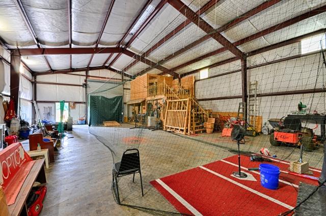 600 Bruce Road Dickson, TN 37055 - Photo 19 of 20 The barn outbuilding has full electric and water service, and even has an alarm system. It's so huge, it currently houses a batting cage net!
