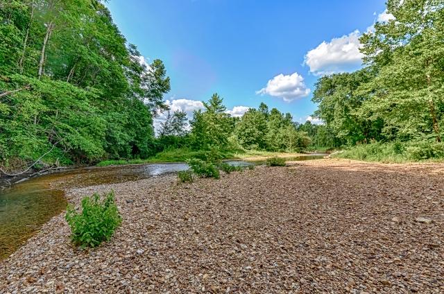 600 Bruce Road Dickson, TN 37055 - Photo 20 of 20 And finally, the home enjoys frontage along the Piney River! A stroll through the backyard leads to this wooded area, where you can enjoy fishing in the deeper spots and wading where it's shallow. Be sure to visit this spot when you view the home!