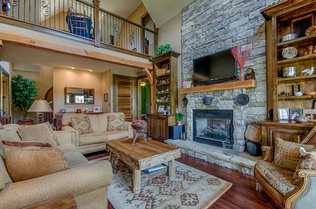 600 Bruce Road Dickson, TN 37055 - Photo 5 of 20 The living room enjoys a gorgeous stone fireplace with hand-hewn Douglas fir mantel and limestone slab hearth, flanked by custom built-in shelving and cabinetry, as well as a soaring vaulted ceiling and hand-scraped oak hardwood flooring.