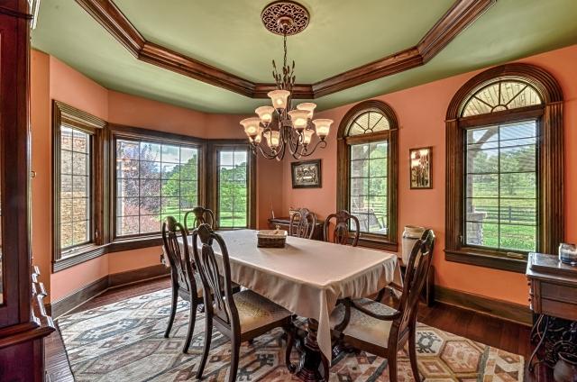 600 Bruce Road Dickson, TN 37055 - Photo 9 of 20 Entertain your guests in style in this sophisticated dining room, with tray ceiling, palladian Pella windows, and hardwood flooring. All the baseboards in the home are extra-wide: eight inches throughout the downstairs and six inches upstairs.