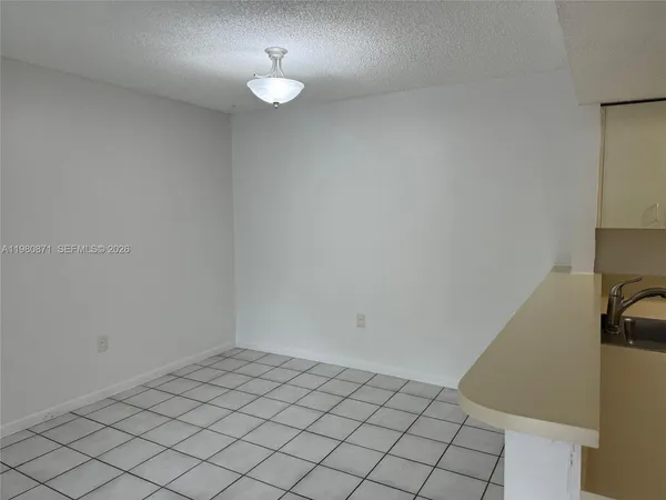 a bathroom with a shower a toilet and a sink
