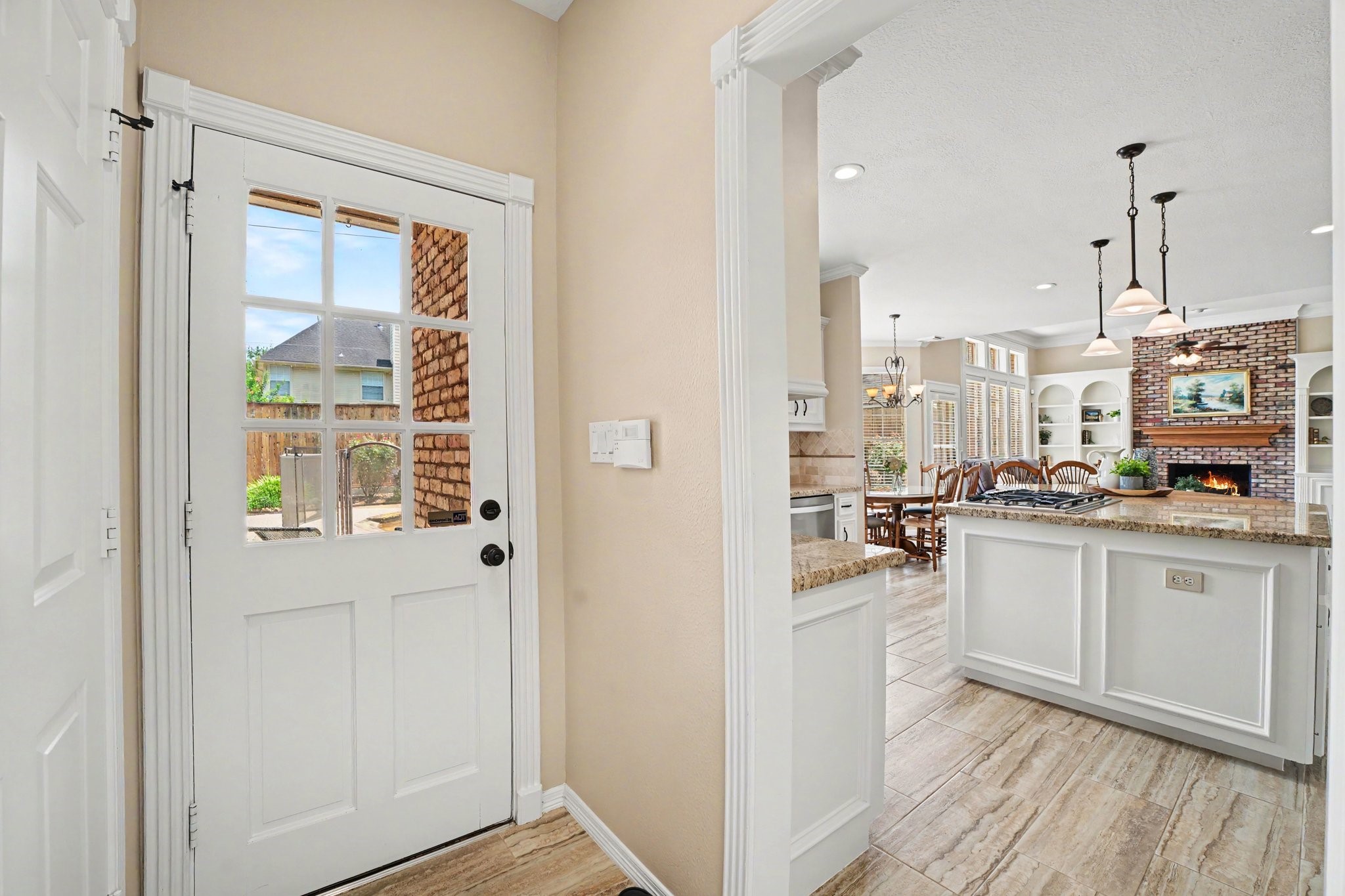 3411 Fir Forest Drive Spring, TX 77388 - Photo 24 of 39 A view from the back door entry and utility room looking out to the kitchen.