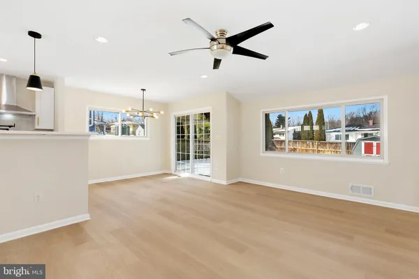 a view of an empty room with a fireplace