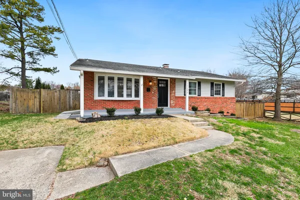 a kitchen with stainless steel appliances granite countertop a refrigerator a stove a sink and a refrigerator