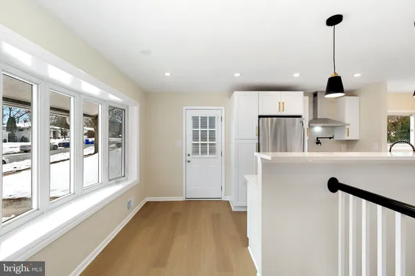 a kitchen with stainless steel appliances granite countertop a stove and a refrigerator