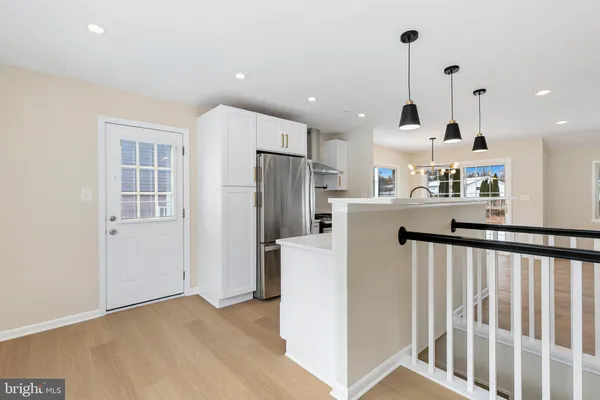 a kitchen with granite countertop a stove and a sink