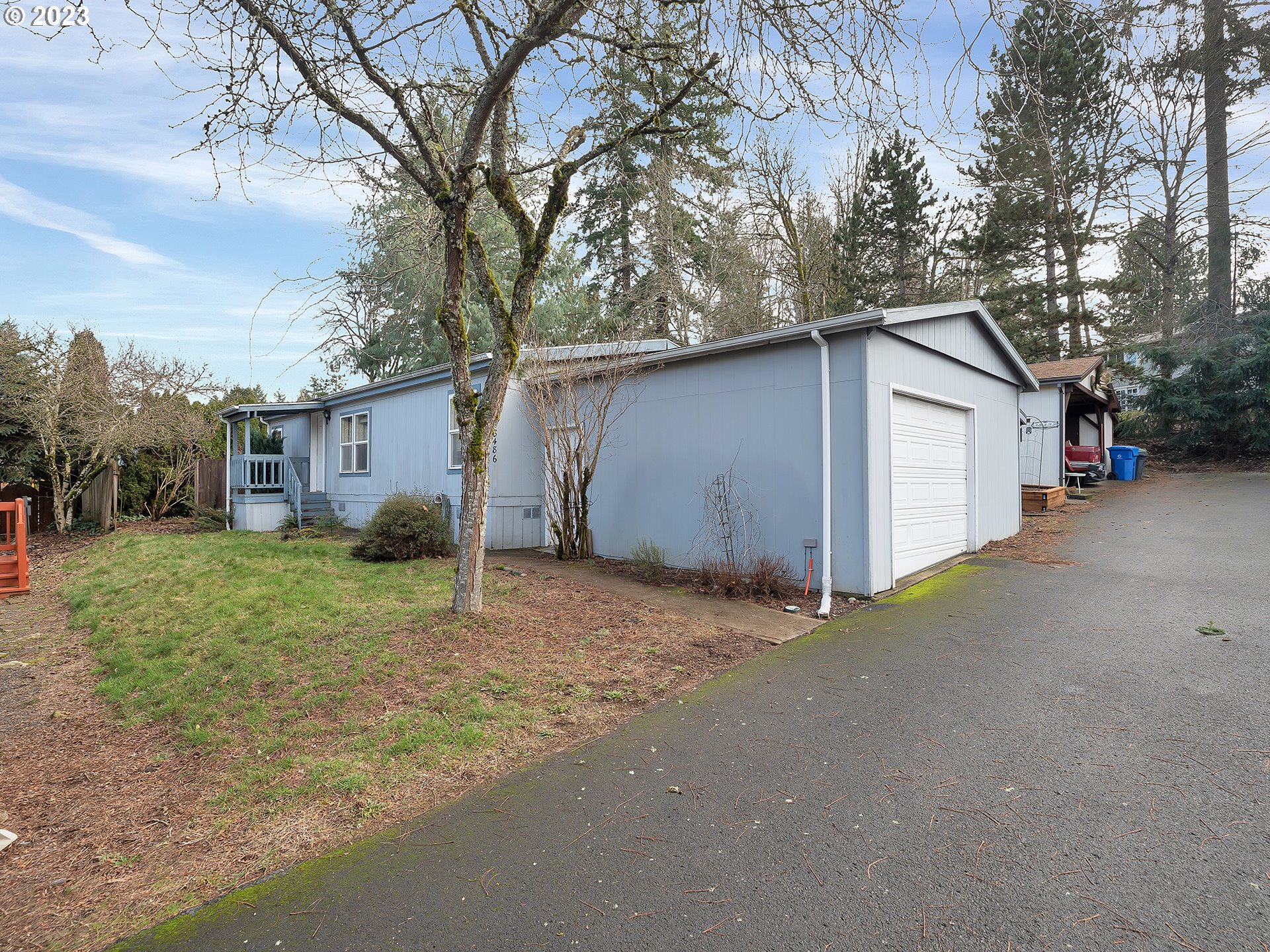 38486 Strawbridge Parkway Sandy, OR 97055 - Photo 1 of 19 a view of a house with a yard and garage