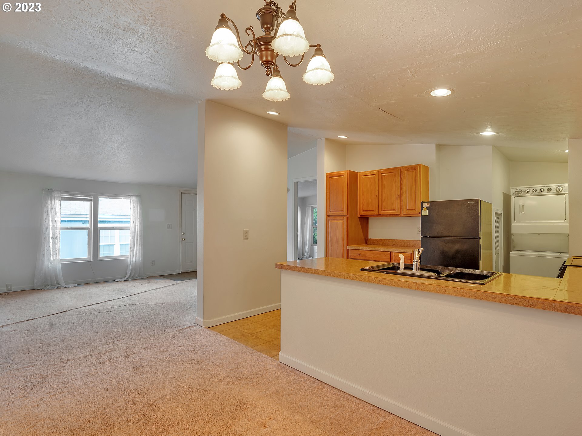 38486 Strawbridge Parkway Sandy, OR 97055 - Photo 14 of 19 a view of a kitchen with a sink and a chandelier