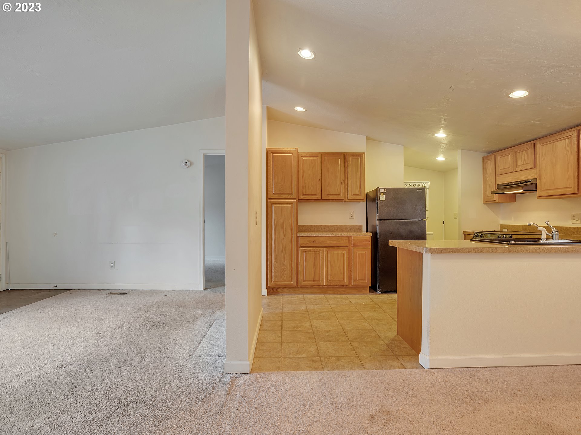 38486 Strawbridge Parkway Sandy, OR 97055 - Photo 16 of 19 a kitchen with refrigerator cabinets and a counter top space
