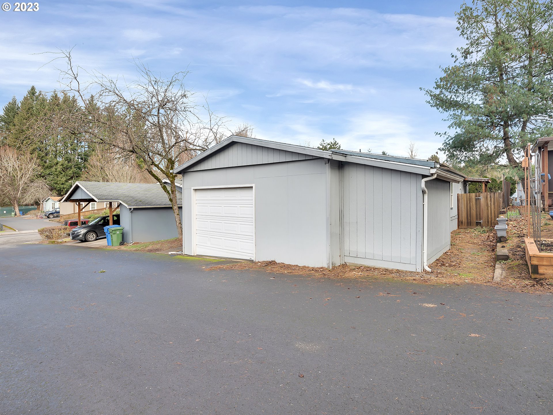 38486 Strawbridge Parkway Sandy, OR 97055 - Photo 3 of 19 a backyard of a house with table and chairs and potted plants