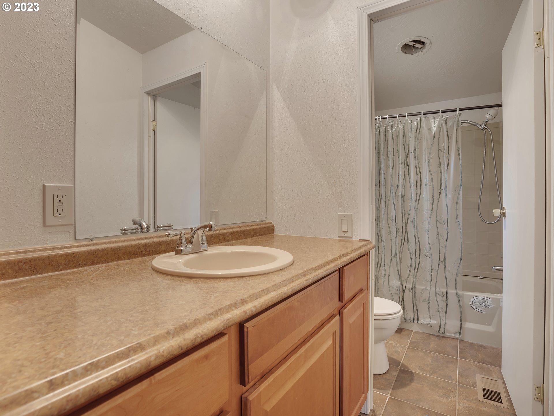 38486 Strawbridge Parkway Sandy, OR 97055 - Photo 9 of 19 a bathroom with a granite countertop sink and a mirror