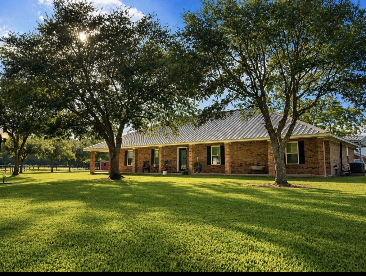 a large house with yard in front of it