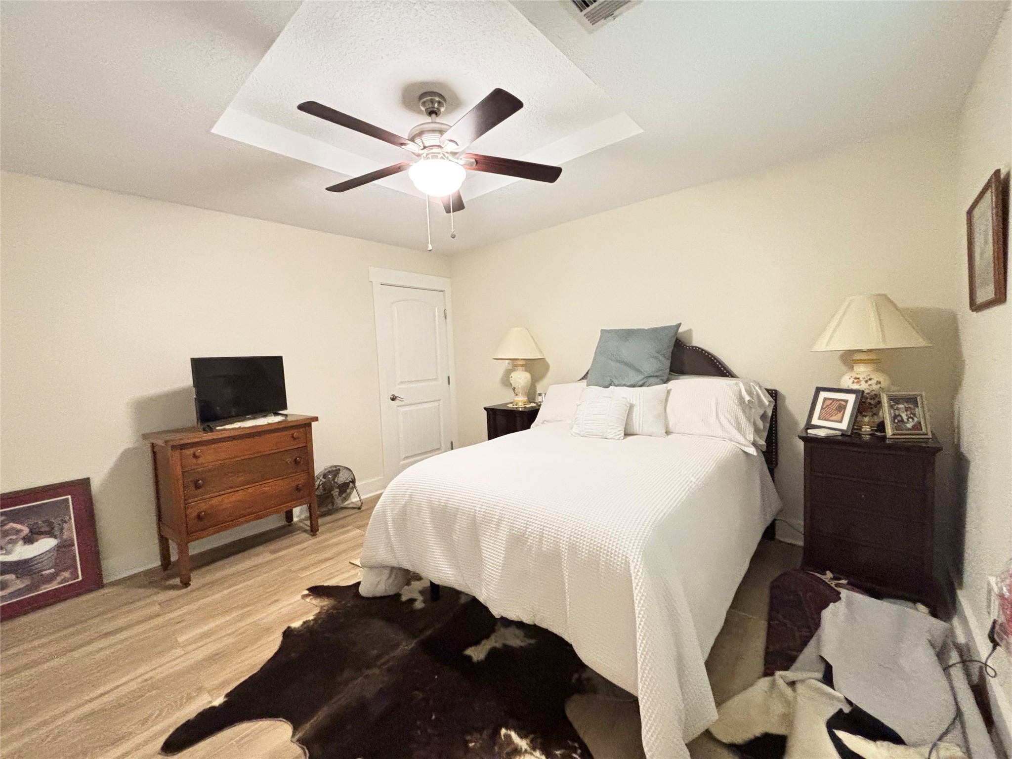 40062 Highway 105 Batson, TX 77519 - Photo 19 of 30 a bedroom with a bed and a television