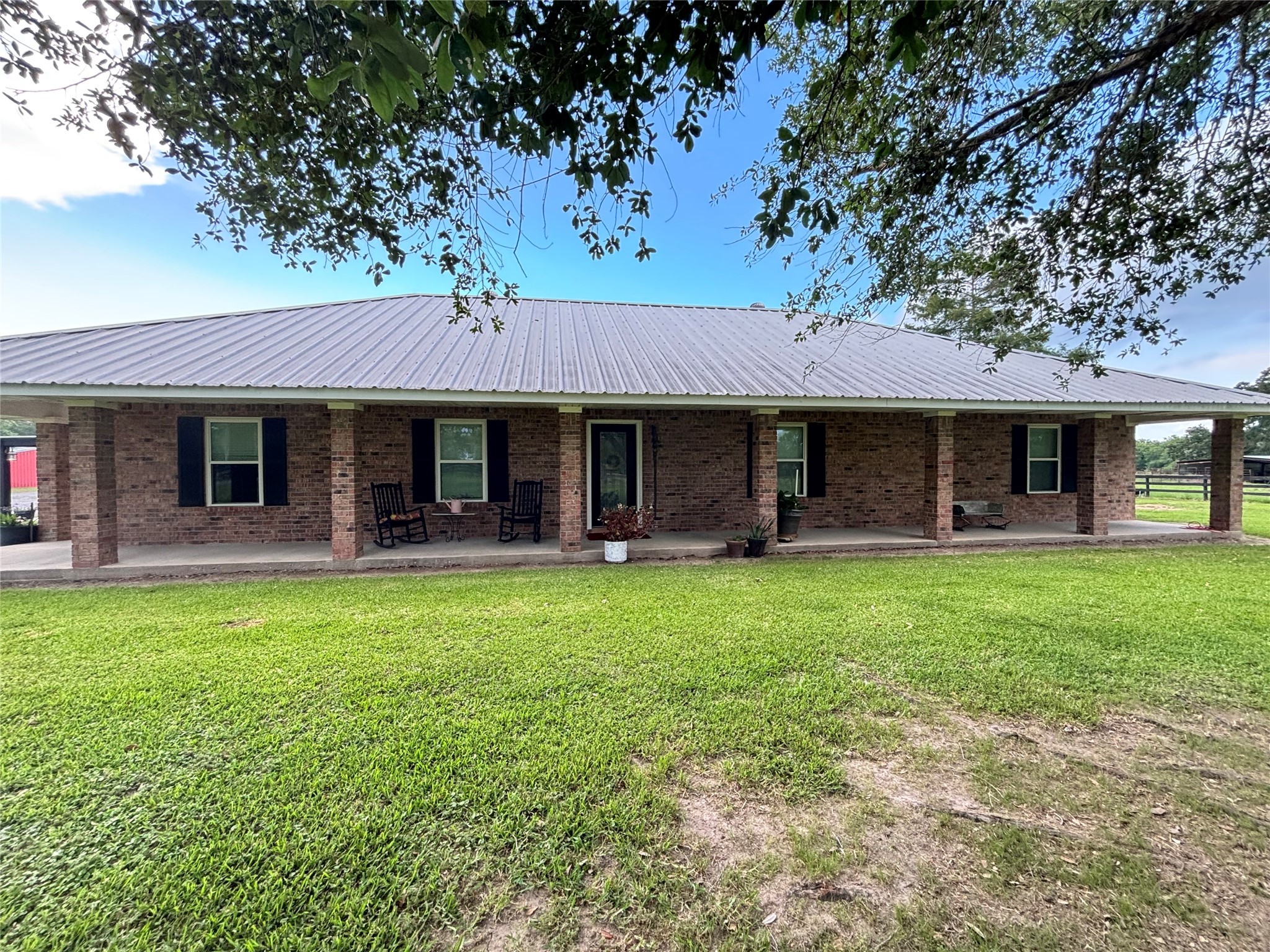 40062 Highway 105 Batson, TX 77519 - Photo 2 of 30 a front view of a house with a garden