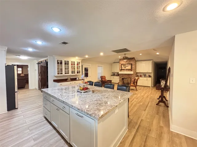 a view of a living room and kitchen counter space