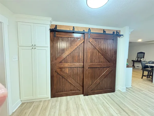 a view of a room with wooden floor and stairs