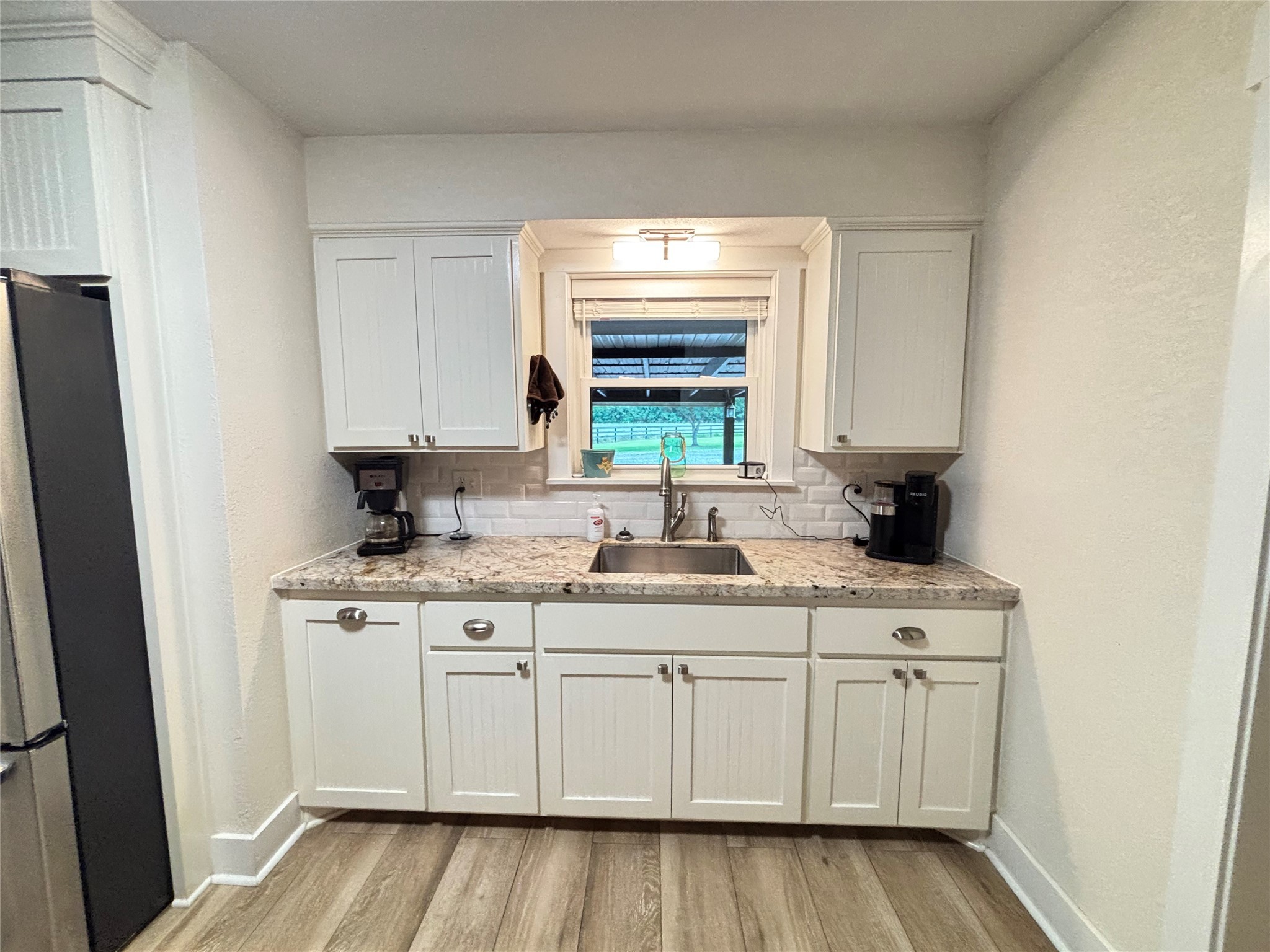 40062 Highway 105 Batson, TX 77519 - Photo 28 of 30 a kitchen with a sink stove and cabinets