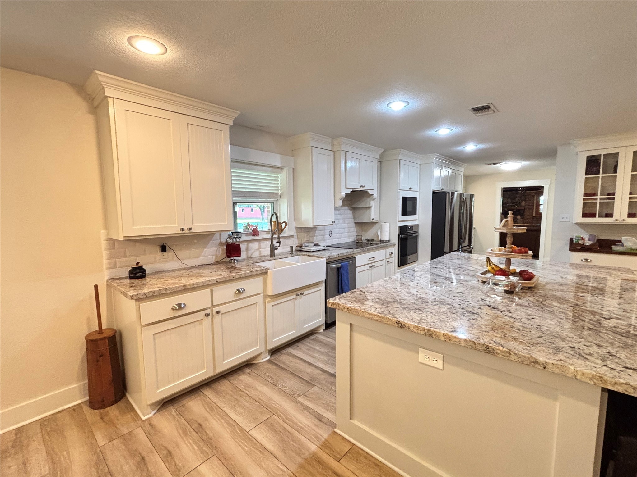 40062 Highway 105 Batson, TX 77519 - Photo 29 of 30 a kitchen with stainless steel appliances granite countertop a sink stove and refrigerator