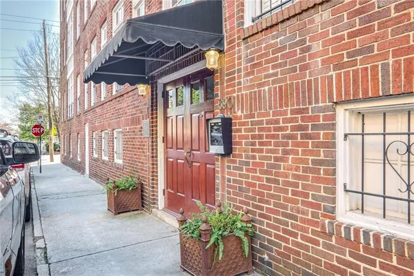 a view of a patio with couches and potted plants
