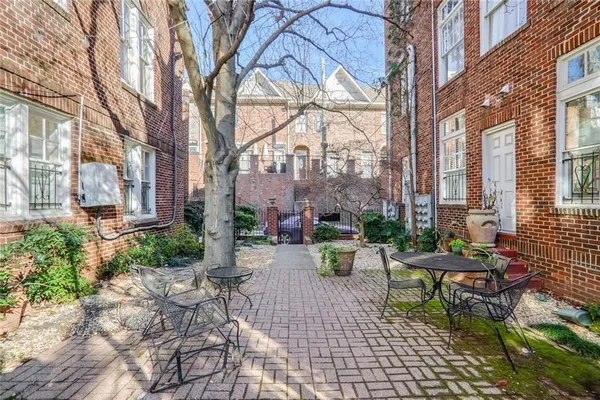 a view of a building with sitting area
