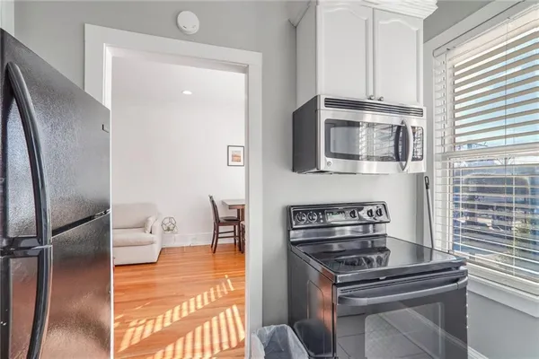 a kitchen with stainless steel appliances and wooden cabinets