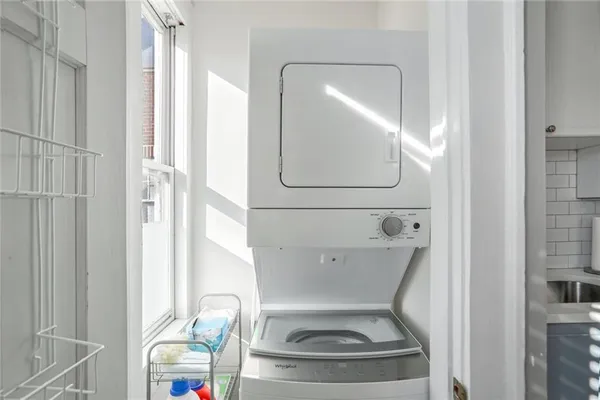 a bathroom with a toilet and a mirror