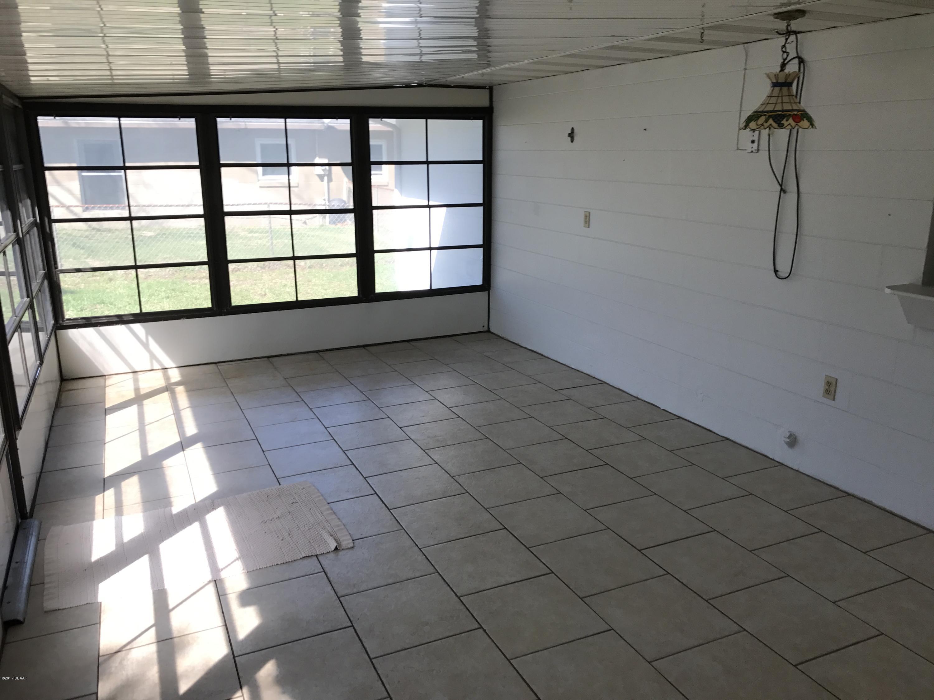 65 Raintree Drive Port Orange, FL 32127 - Photo 7 of 19 Enclosed Lanai