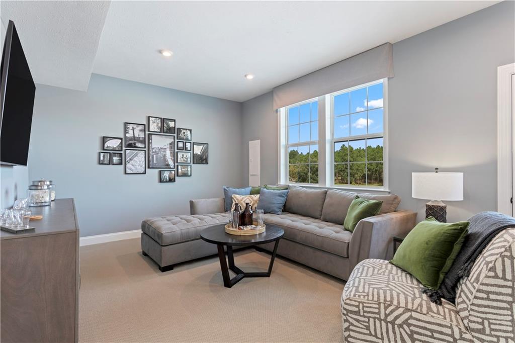 111 Affinity Drive Harmony, PA 16037 - Photo 10 of 16 a living room with furniture and a flat screen tv
