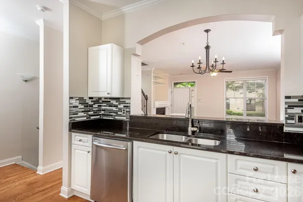 a kitchen with a sink and cabinets