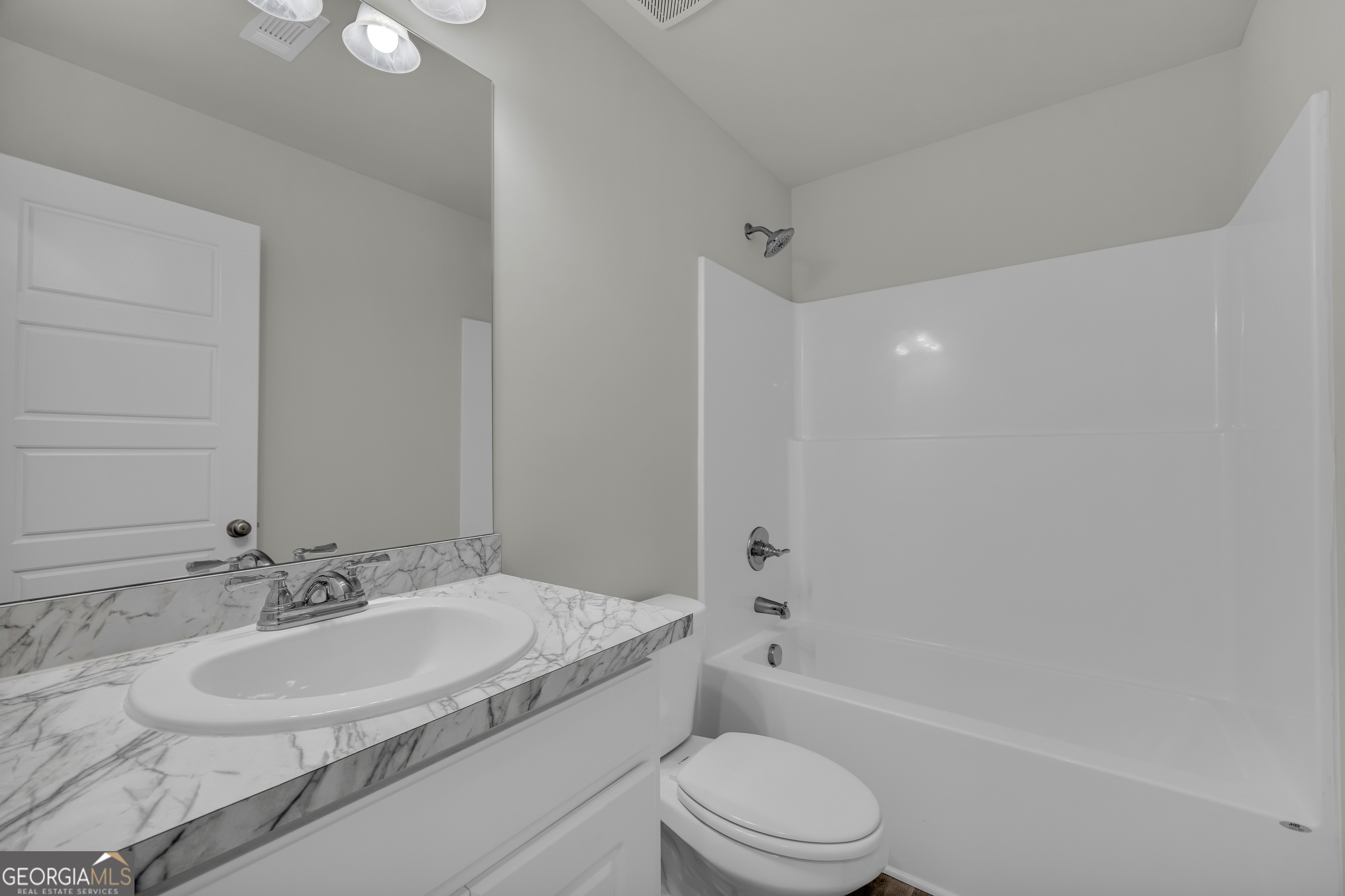 110 Sewell Road Lavonia, GA 30553 - Photo 46 of 73 a bathroom with a granite countertop sink a toilet and shower