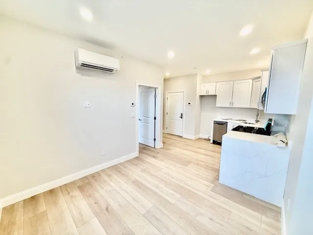 a view of kitchen and wooden floor