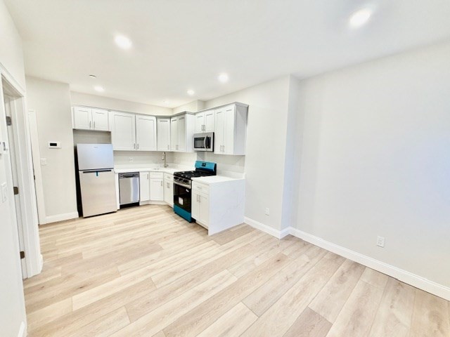 220 Winthrop Street, Unit 301 Winthrop, MA 02152 - Photo 3 of 8 a view of kitchen with wooden floor