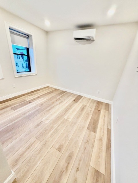 220 Winthrop Street, Unit 301 Winthrop, MA 02152 - Photo 5 of 8 a view of empty room with wooden floor