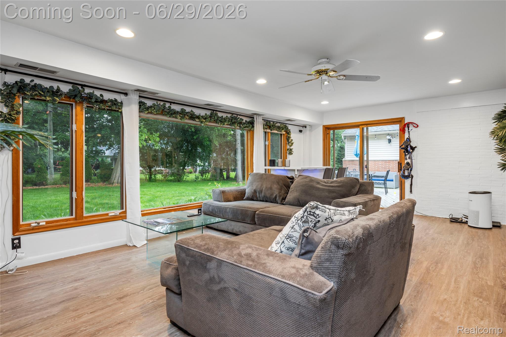 6085 Worlington Road Bloomfield Hills, MI 48301 - Photo 29 of 75 Spacious Family Room featuring wood-finish flooring, recessed lighting, a ceiling fan, views of the Private Backyard, along with Doorwall to rear Patio