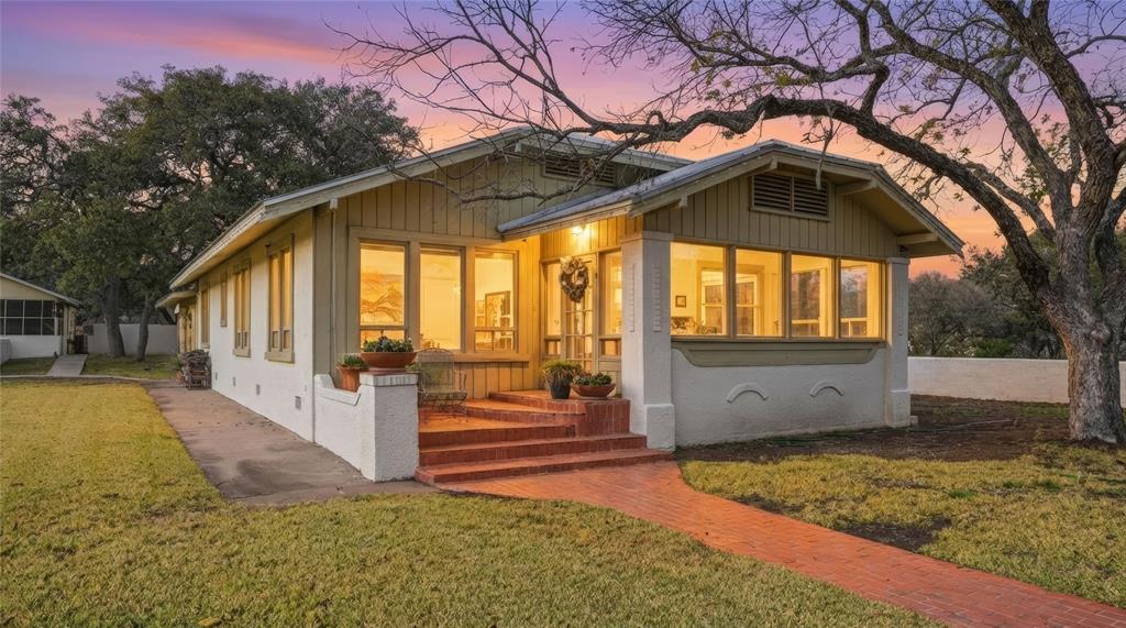 a view of a house with a yard