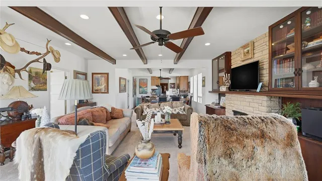 a dining room with furniture a window and wooden floor