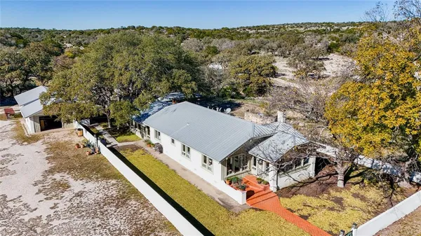 aerial view of a house with a yard