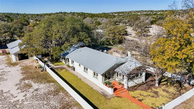 aerial view of a house with a yard
