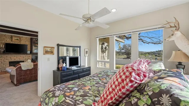 a bedroom with a large bed and a window