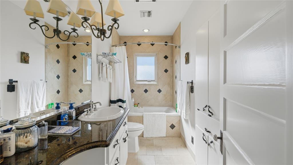Undisclosed Address Del Rio, TX 78840 - Photo 24 of 40 a bathroom with a sink a toilet a mirror and shower