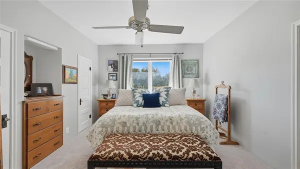 a kitchen with a refrigerator a table and chairs in it